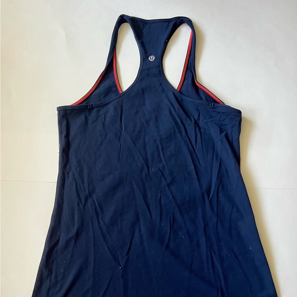 Cool Racerback, Navy with contrasting orange stitching.